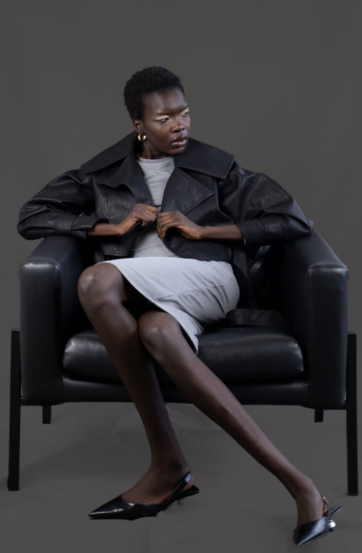 Model wearing the asym vegan leather oversized jacket. Size medium
