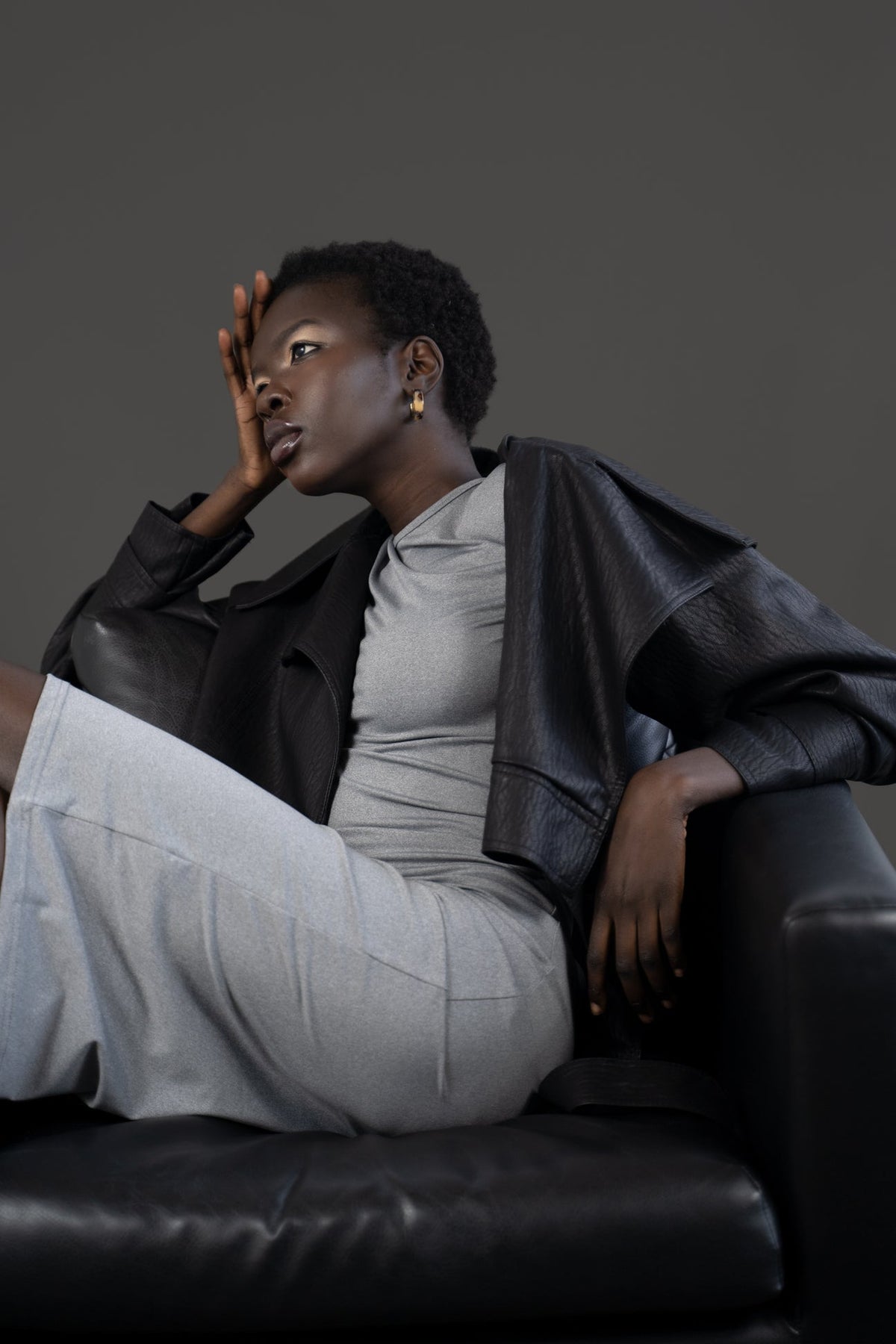 Model wearing the asym vegan leather oversized jacket. Size medium