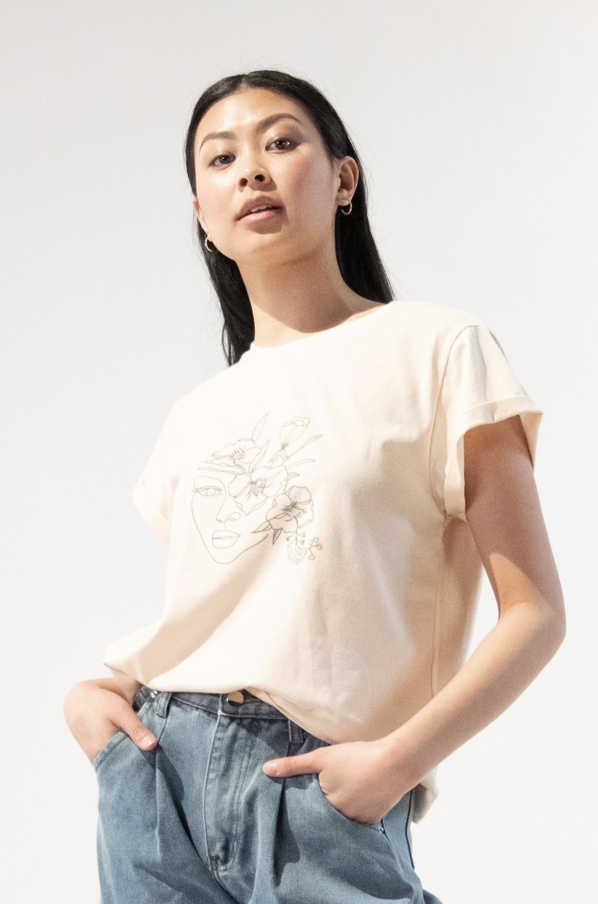 Model wearing a Floral Gal Graphic T-Shirt with vibrant floral design