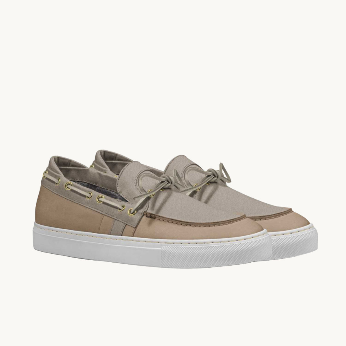 Side view of beige boat loafer sneakers with laces on the side. 